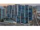 Modern condominium building with a pool and luxurious balconies at 1155 N Gulfstream Ave # 706, Sarasota, FL 34236