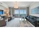 Cozy living room with stylish furnishings, a modern coffee table, and an expansive view of the harbor at 1155 N Gulfstream Ave # 706, Sarasota, FL 34236