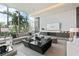 An elegant community lounge area that offers comfortable seating arrangements and a serene view through large windows at 1155 N Gulfstream Ave # 706, Sarasota, FL 34236