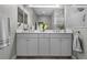 The spacious bathroom offers a double sink vanity and a separate walk-in shower at 11707 Gramercy Park Ave, Bradenton, FL 34211