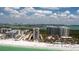 Aerial view of beachfront condos, pool, and direct beach access providing an unparalleled coastal lifestyle at 1212 Benjamin Franklin Dr # 901, Sarasota, FL 34236