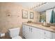 A full bathroom, with a granite countertop, vanity, and an enclosed toilet at 1212 Benjamin Franklin Dr # 901, Sarasota, FL 34236