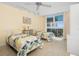 Bright bedroom with two beds, large windows offering views, and neutral-colored tile flooring at 1212 Benjamin Franklin Dr # 901, Sarasota, FL 34236
