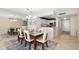 Open concept dining and kitchen area with modern appliances at 1212 Benjamin Franklin Dr # 901, Sarasota, FL 34236