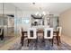 Open dining area, with the view of the kitchen with stainless steel appliances at 1212 Benjamin Franklin Dr # 901, Sarasota, FL 34236