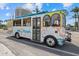 Charming Sarasota trolley with colorful seaside graphics, providing convenient transportation and a unique local experience at 1212 Benjamin Franklin Dr # 901, Sarasota, FL 34236