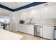 This updated kitchen has white cabinetry and stainless appliances at 1212 Benjamin Franklin Dr # 901, Sarasota, FL 34236