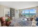 Bright living room with floor to ceiling windows with a balcony overlooking the ocean at 1212 Benjamin Franklin Dr # 901, Sarasota, FL 34236