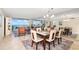 Open-concept living room and dining room with ocean view at 1212 Benjamin Franklin Dr # 901, Sarasota, FL 34236