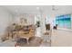 Spacious living room with elegant furniture, tile floors, and plenty of natural light at 1212 Benjamin Franklin Dr # 901, Sarasota, FL 34236