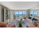 Bright living room with floor to ceiling windows and balcony overlooking the ocean at 1212 Benjamin Franklin Dr # 901, Sarasota, FL 34236