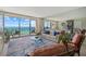 Comfortable living room featuring ocean views, a cozy seating area, and a bright open space at 1212 Benjamin Franklin Dr # 901, Sarasota, FL 34236