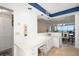 Bright living room with white counters, a dining area, and an ocean view, creating an open and inviting space at 1212 Benjamin Franklin Dr # 901, Sarasota, FL 34236