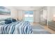 Comfortable bedroom with tile floors, featuring ocean views and modern decor at 1212 Benjamin Franklin Dr # 901, Sarasota, FL 34236