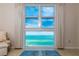 Panoramic ocean views from the living room windows create a serene and inviting atmosphere at 1212 Benjamin Franklin Dr # 901, Sarasota, FL 34236