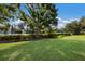 Green backyard overlooking lake at 1217 92Nd Nw St, Bradenton, FL 34209