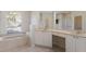 Bathroom featuring a soaking tub and dual vanity sinks, with ample counter space at 1217 92Nd Nw St, Bradenton, FL 34209