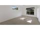 Bedroom with neutral carpeting, windows, and ample sunlight at 1217 92Nd Nw St, Bradenton, FL 34209