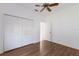 Bright bedroom featuring hardwood floors, a ceiling fan and a closet at 1217 92Nd Nw St, Bradenton, FL 34209
