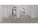 Bright open living space with white tile flooring, neutral walls, and classic column accents at 1217 92Nd Nw St, Bradenton, FL 34209