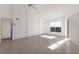 Spacious living room with tile floors, ceiling fan, and natural light at 1217 92Nd Nw St, Bradenton, FL 34209