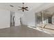 Bright and airy living room with tile floors, ceiling fan, and sliding glass doors to patio at 1217 92Nd Nw St, Bradenton, FL 34209