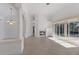 Open living space with neutral tile flooring, fireplace, and sliding doors leading to an outdoor space at 1217 92Nd Nw St, Bradenton, FL 34209