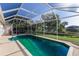 Sparkling pool with screened-in enclosure and picturesque view at 1217 92Nd Nw St, Bradenton, FL 34209