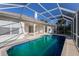 Inviting pool area with blue tiled in-ground pool at 1217 92Nd Nw St, Bradenton, FL 34209