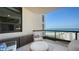 Relaxing balcony with comfortable furniture and beachfront view at 1281 Gulf Of Mexico Dr # 906, Longboat Key, FL 34228