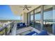 Spacious balcony featuring comfortable seating, dining area, and panoramic coastal views at 1281 Gulf Of Mexico Dr # 906, Longboat Key, FL 34228
