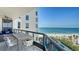 Relaxing balcony area with seating and ocean views, perfect for outdoor dining and lounging at 1281 Gulf Of Mexico Dr # 906, Longboat Key, FL 34228