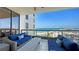 Inviting balcony with wicker furniture offers stunning ocean views and comfortable seating at 1281 Gulf Of Mexico Dr # 906, Longboat Key, FL 34228