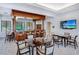 An entertainment area with a full bar and multiple tables for seating and socializing is beautifully designed and well lit at 1281 Gulf Of Mexico Dr # 906, Longboat Key, FL 34228