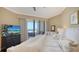 Relaxing primary bedroom with balcony access and beautiful view at 1281 Gulf Of Mexico Dr # 906, Longboat Key, FL 34228