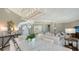 Open-concept dining area with marble table, seamlessly connected to the living room and kitchen spaces at 1281 Gulf Of Mexico Dr # 906, Longboat Key, FL 34228