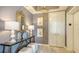Tastefully decorated hallway with mirror, lamps, decor and elevator access at 1281 Gulf Of Mexico Dr # 906, Longboat Key, FL 34228