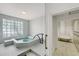 Relaxing hot tub area with tiled walls and a private locker room at 1281 Gulf Of Mexico Dr # 906, Longboat Key, FL 34228