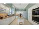 Bright kitchen features custom white cabinetry, granite countertops, and modern stainless appliances at 1281 Gulf Of Mexico Dr # 906, Longboat Key, FL 34228