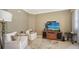 Comfortable living room featuring neutral tones, plush seating, and a modern entertainment center at 1281 Gulf Of Mexico Dr # 906, Longboat Key, FL 34228