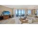Bright living room with ocean view and a flat screen television at 1281 Gulf Of Mexico Dr # 906, Longboat Key, FL 34228