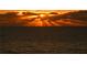 The ocean at sunset offers beautiful gold highlights that create a scene of warmth and tranquility at 1281 Gulf Of Mexico Dr # 906, Longboat Key, FL 34228