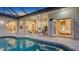 Inviting backyard pool and patio area with comfortable seating and seamless access to indoor living spaces at 13625 3Rd Ne Ave, Bradenton, FL 34212