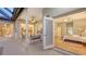 Bedroom with access to a covered patio with furniture, overlooking more interior rooms at 13625 3Rd Ne Ave, Bradenton, FL 34212
