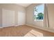 Bright bedroom with wood floors, a large window, and ample closet space at 13625 3Rd Ne Ave, Bradenton, FL 34212