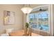 Bright dining space with pool views, modern decor, and natural light at 13625 3Rd Ne Ave, Bradenton, FL 34212
