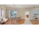 Charming dining room with a view of the pool, stylish decor, and plenty of natural light at 13625 3Rd Ne Ave, Bradenton, FL 34212