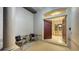 Inviting entryway features neutral tones, stylish seating, and an open door into the dining area at 13625 3Rd Ne Ave, Bradenton, FL 34212