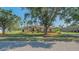 Charming single-story home with a well-manicured lawn, mature trees, and tasteful landscaping at 13625 3Rd Ne Ave, Bradenton, FL 34212