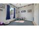 Home gym with exercise equipment, including weights, step platform and dark rubber flooring at 13625 3Rd Ne Ave, Bradenton, FL 34212